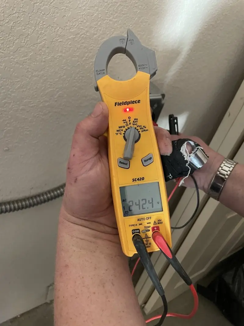 Voltage testing with clamp meter during Aluminum Wiring Replacement in Green Level